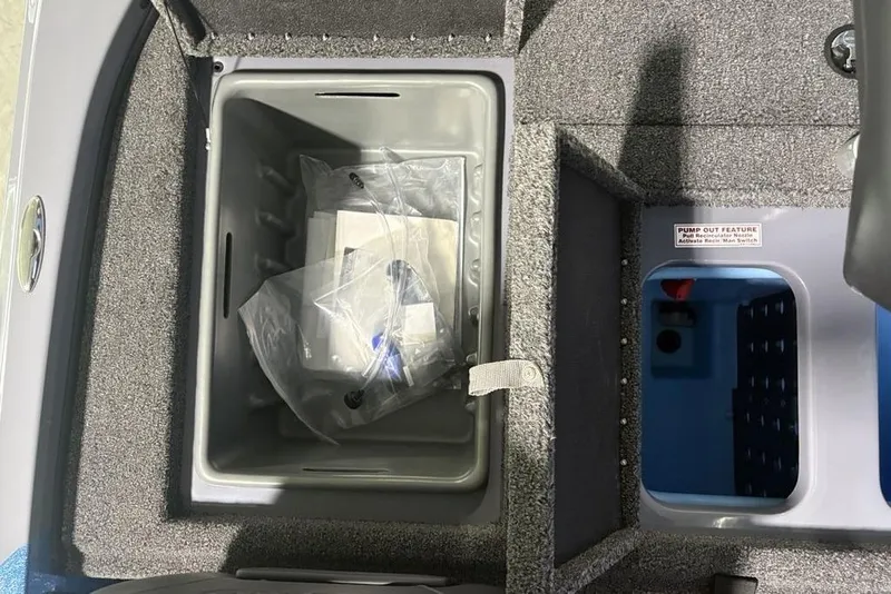 Slide: The Image of Storage compartments in a 2026 Nitro Z18 Pro boat, featuring pump-out feature label. - 26