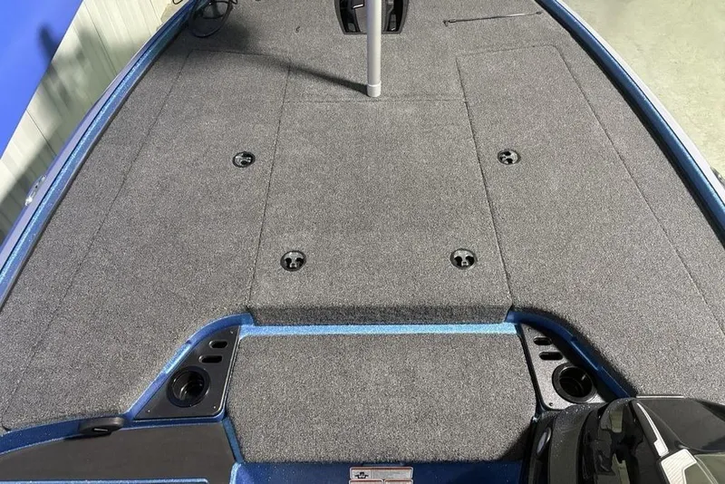Slide: The Image of 2026 Nitro Z18 Pro boat deck with gray carpet and storage compartments. - 4
