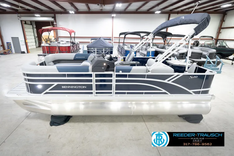 The Image of 2026 Bennington 20 SFC pontoon boat in showroom, featuring sleek design and modern amenities. - 0