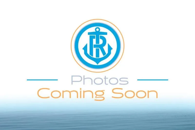 Slide: The Image of 2026 Bennington 20 SFC pontoon boat in a spacious indoor showroom. - 1