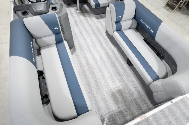 Slide: The Image of 2026 Bennington 20 SFC boat interior with gray and blue seating, carpeted floor. - 13