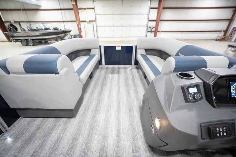 Slide: The Image of Interior of 2026 Bennington 20 SFC pontoon boat with modern seating and steering console. - 20
