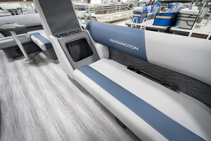 Slide: The Image of 2026 Bennington 20 SFC pontoon boat interior with blue and gray seating. - 23