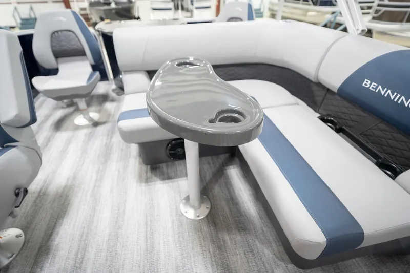 Slide: The Image of 2026 Bennington 20 SFC pontoon boat interior with gray and blue seating. - 25