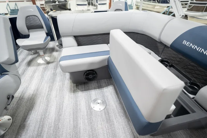 Slide: The Image of 2026 Bennington 20 SFC boat interior with blue and gray seating, modern design. - 28