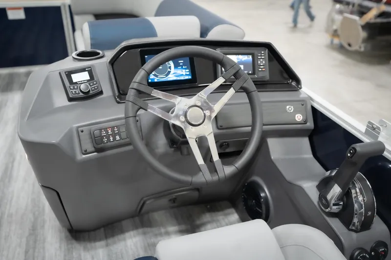 Slide: The Image of 2026 Bennington 20 SFC boat dashboard with steering wheel and digital displays. - 36