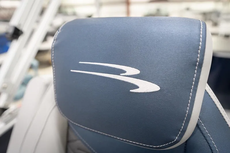 Slide: The Image of 2026 Bennington 20 SFC boat interior with plush seating in a showroom. - 45