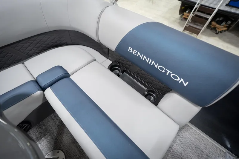 Slide: The Image of 2026 Bennington 20 SFC boat interior with blue and white seating, Reeder-Trausch logo. - 48