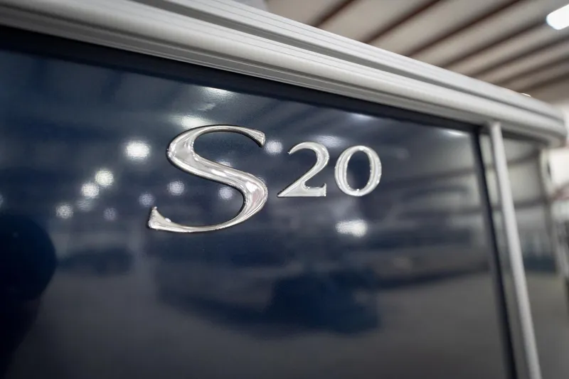 Slide: The Image of Close-up of 2026 Bennington 20 SFC boat logo with dealership contact information. - 55