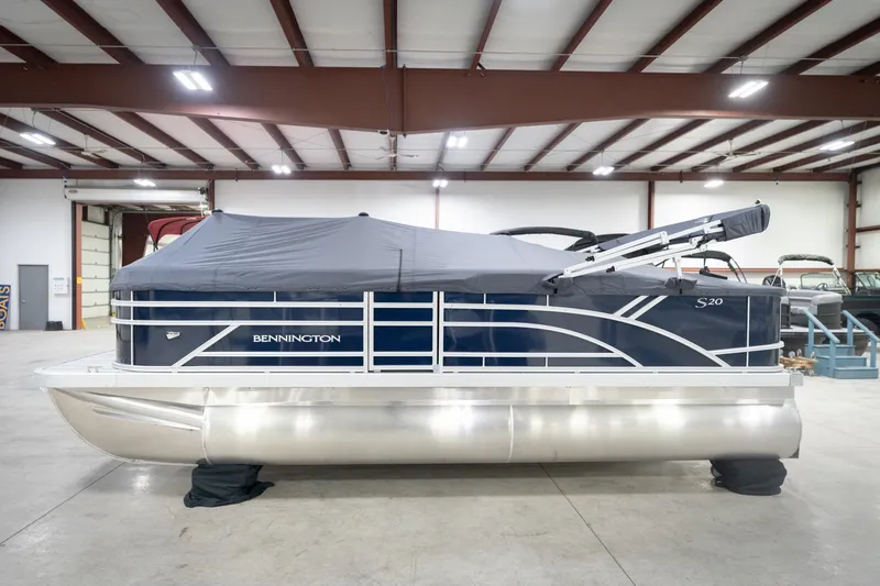 Slide: The Image of 2026 Bennington 20 SFC boat with sleek design and logo detail. - 56