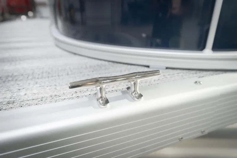 Slide: The Image of 2026 Bennington 20 SFC pontoon boat in indoor showroom, covered and ready for display. - 57