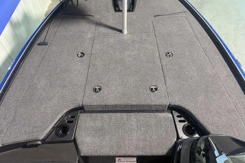 Slide: The Image of 2026 Nitro Z18 Pro boat deck with gray carpet and storage compartments. - 11