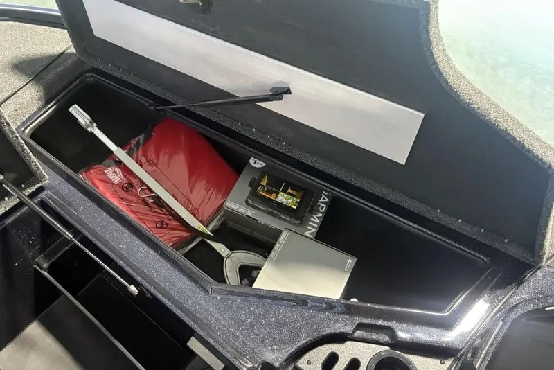 Slide: The Image of Storage compartment of 2026 Nitro Z18 Pro boat with equipment and accessories. - 14