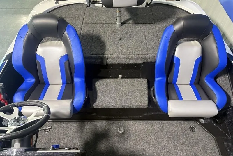 Slide: The Image of 2026 Nitro Z18 Pro boat interior with blue and gray seats, steering wheel visible. - 17