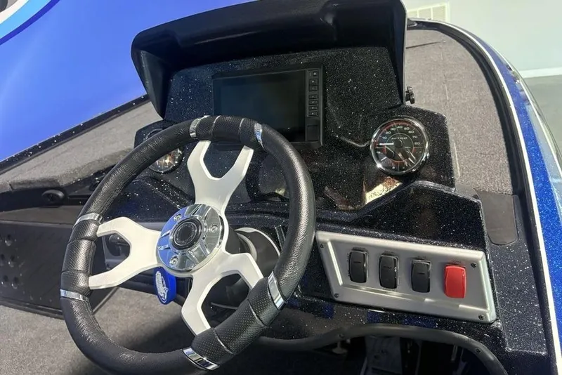 Slide: The Image of Steering console of 2026 Nitro Z18 Pro boat with dashboard controls and speedometer. - 23