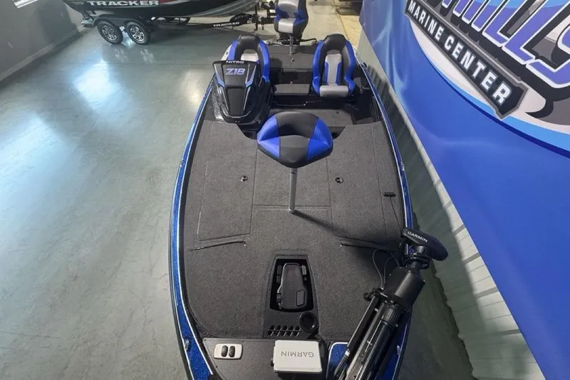 Slide: The Image of 2026 Nitro Z18 Pro boat interior with blue accents at a marine center. - 31
