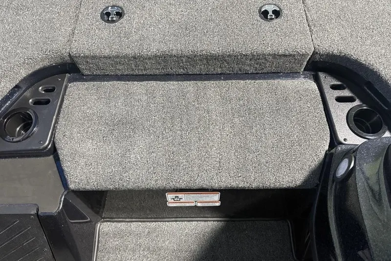 Slide: The Image of Carpeted deck of a 2026 Nitro Z18 Pro boat with cup holders. - 9