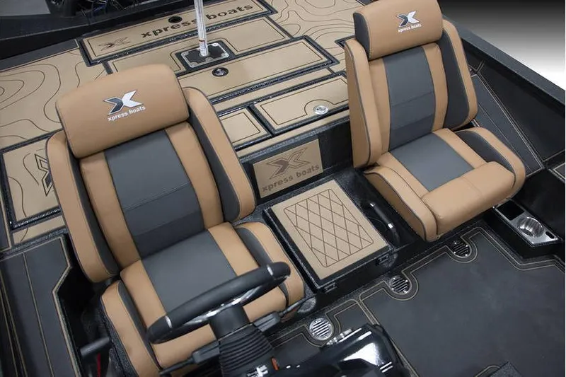 Slide: The Image of Interior of 2026 Xpress X21 Pro boat with tan and black seating. - 4
