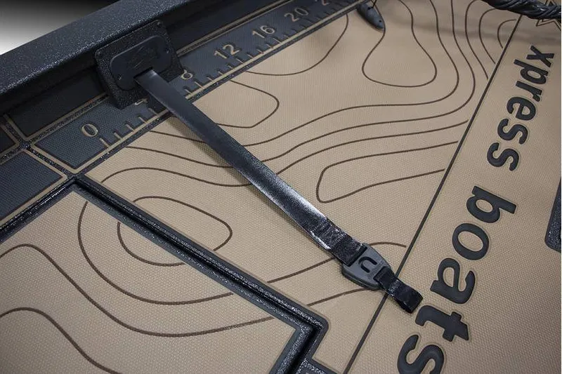 Slide: The Image of Xpress X21 Pro 2026 boat deck with measuring ruler and strap detail. - 7