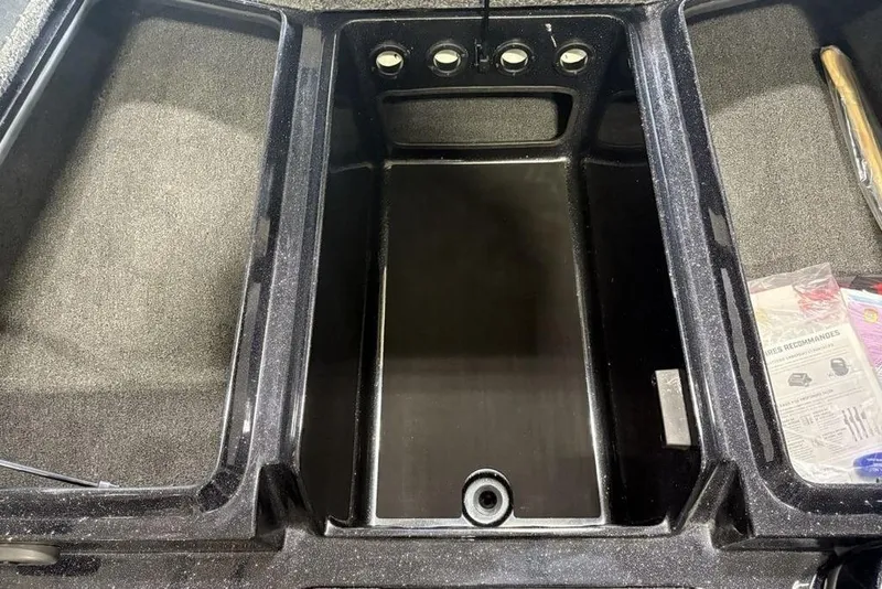 Slide: The Image of Storage compartment of 2026 Nitro Z17 boat, featuring multiple sections and accessories. - 11