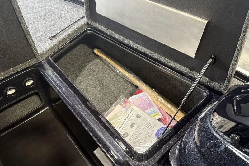 Slide: The Image of Storage compartment of 2026 Nitro Z17 boat, featuring organized space and accessories. - 15