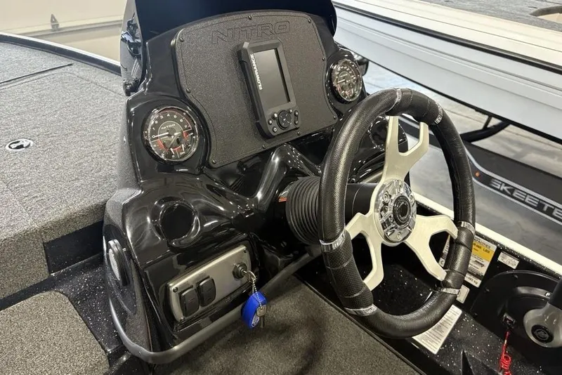 Slide: The Image of Steering console of a 2026 Nitro Z17 boat with gauges and controls. - 18