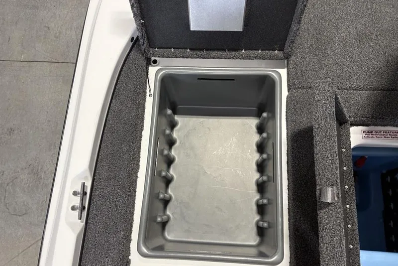 Slide: The Image of Open storage compartment in a 2026 Nitro Z17 boat, featuring a gray interior. - 19