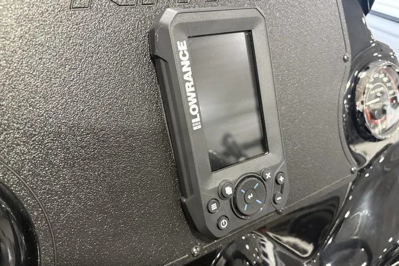 Slide: The Image of Lowrance device on 2026 Nitro Z17 dashboard, featuring a textured black surface. - 20