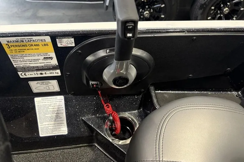 Slide: The Image of Control panel of a 2026 Nitro Z17 boat with capacity label and throttle lever. - 24