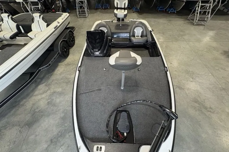 Slide: The Image of 2026 Nitro Z17 boat interior with seating and equipment, displayed in a showroom. - 30