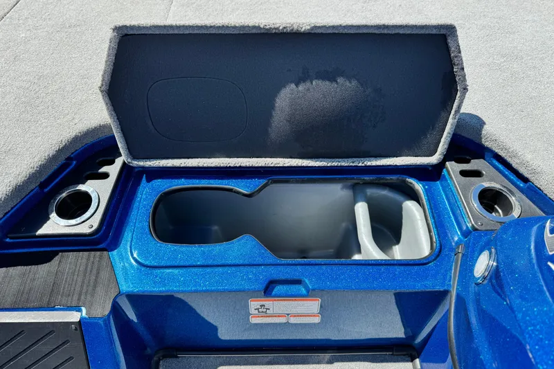 Slide: The Image of Open storage compartment in a 2022 Nitro Z19 boat, featuring a sleek blue design. - 11