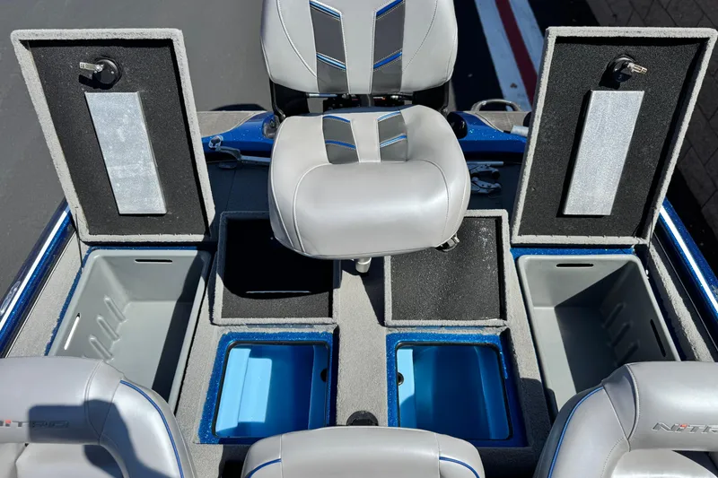 Slide: The Image of 2022 Nitro Z19 boat interior with storage compartments and seating. - 15