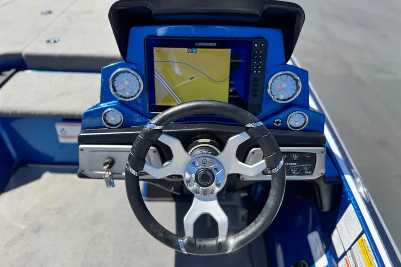 Slide: The Image of Steering wheel and dashboard of 2022 Nitro Z19 boat with navigation display. - 18
