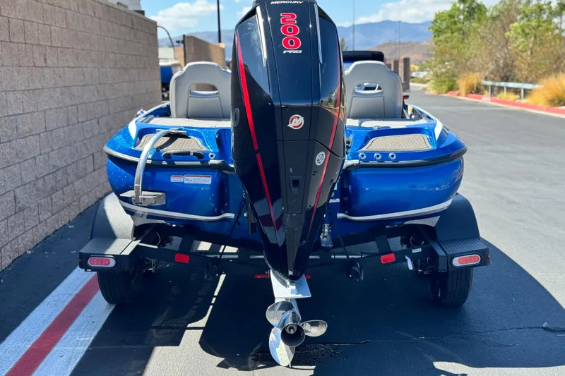 Slide: The Image of 2022 Nitro Z19 boat with Mercury 200 Pro XS engine, parked on a sunny day. - 4