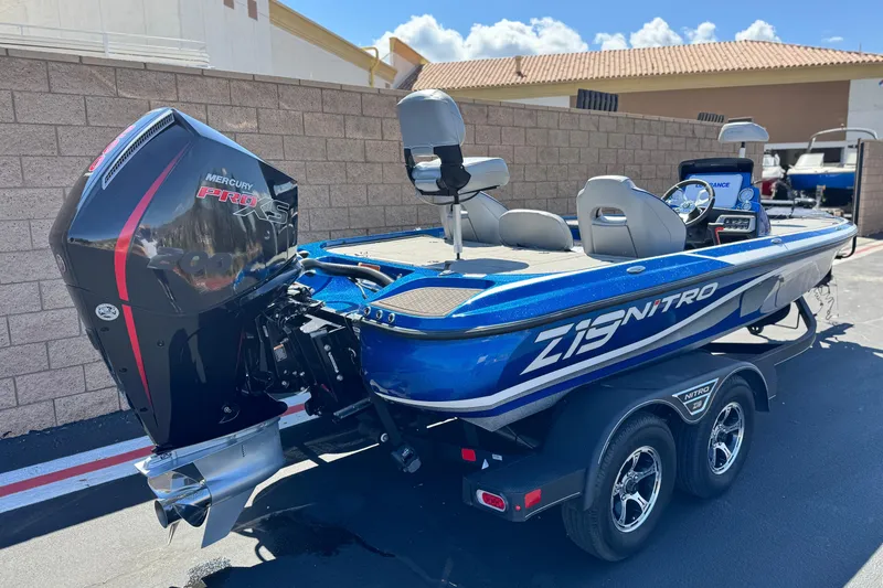 Slide: The Image of 2022 Nitro Z19 boat with Mercury Pro XS engine, parked outdoors. - 5
