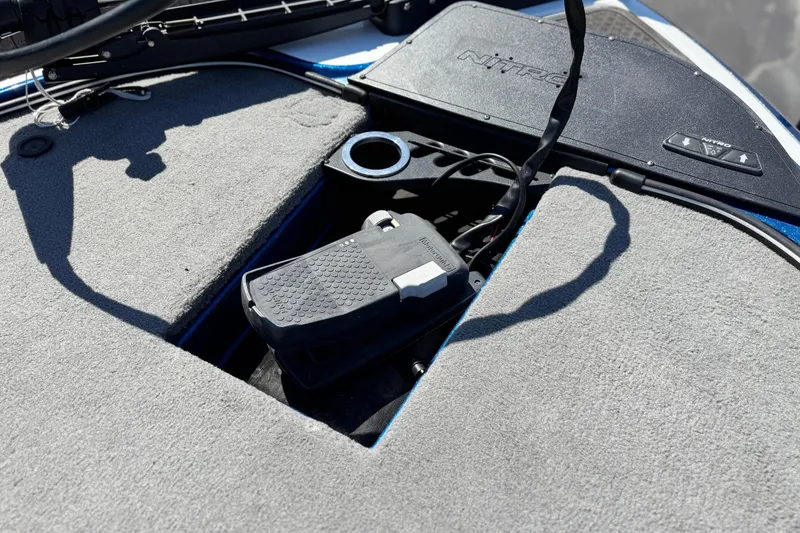 Slide: The Image of 2022 Nitro Z19 boat deck with pedal and storage compartment. - 8