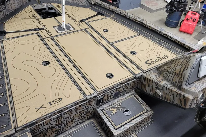 Slide: The Image of 2026 Xpress X21 Pro boat deck with SeaDek flooring and storage compartments. - 4