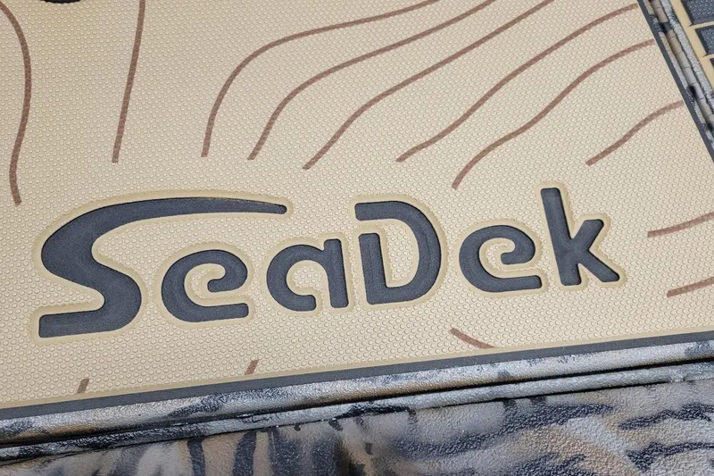 Slide: The Image of SeaDek logo on Xpress X21 Pro 2026 boat deck, textured surface design. - 6