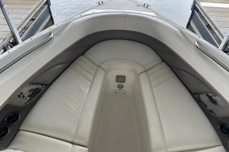 Slide: The Image of Bow seating area of a 2003 Cobalt 282 boat with white upholstery. - 10
