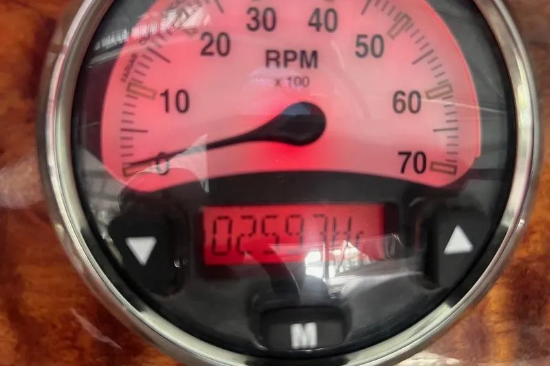 Slide: The Image of Close-up of a 2003 Cobalt 282 RPM gauge displaying 2597.4 hours. - 6