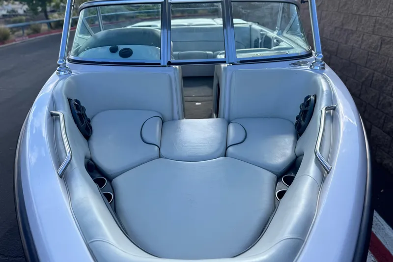 Slide: The Image of 2006 Correct Craft Super Air Nautique 210 Sport boat interior with white leather seating. - 13