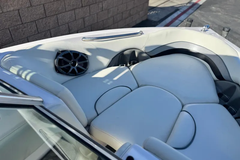 Slide: The Image of Interior of 2006 Correct Craft Super Air Nautique 210 Sport boat with cushioned seating. - 15