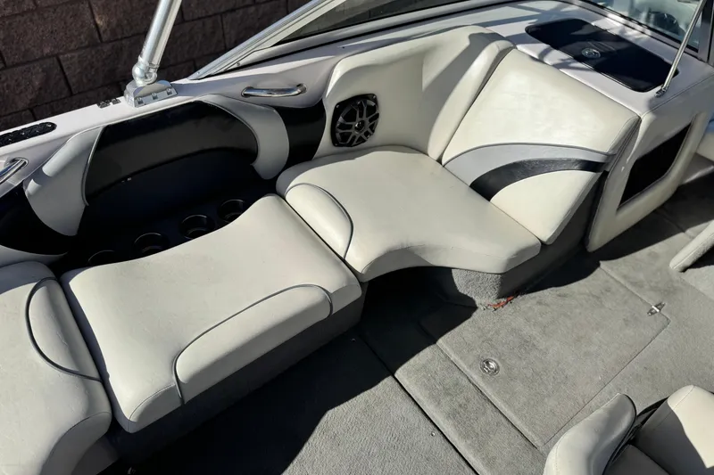 Slide: The Image of 2006 Correct Craft Super Air Nautique 210 Sport interior with white and black seating. - 22