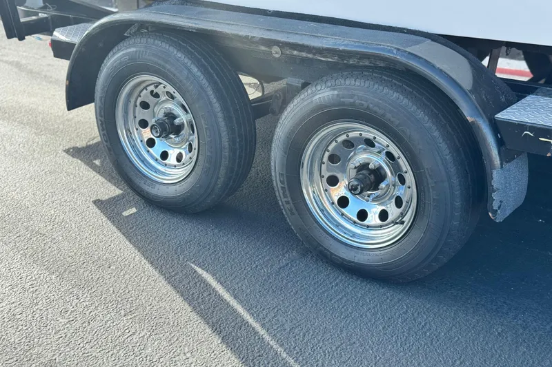 Slide: The Image of Trailer wheels of a 2006 Correct Craft Super Air Nautique 210 Sport boat. - 29
