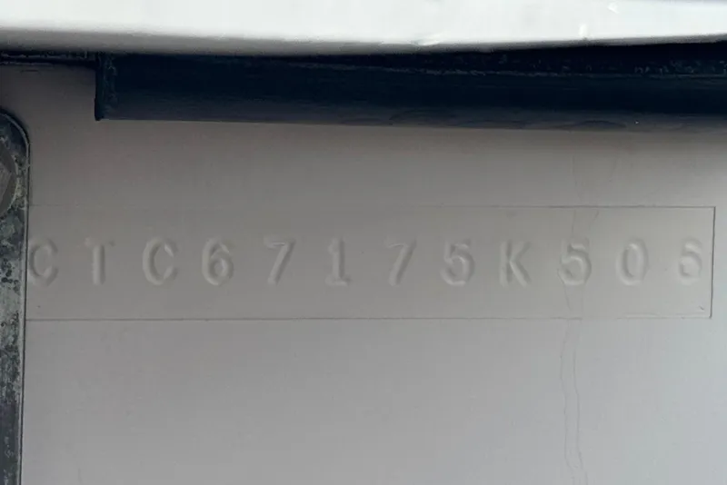 Slide: The Image of Hull identification number on 2006 Correct Craft Super Air Nautique 210 Sport boat. - 32