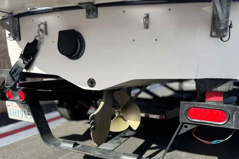 Slide: The Image of Rear view of 2006 Correct Craft Super Air Nautique 210 Sport boat on trailer. - 7