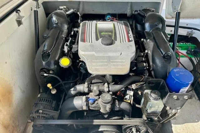 Slide: The Image of Engine compartment of a 2015 Cobalt 220S boat, showcasing a powerful motor. - 17