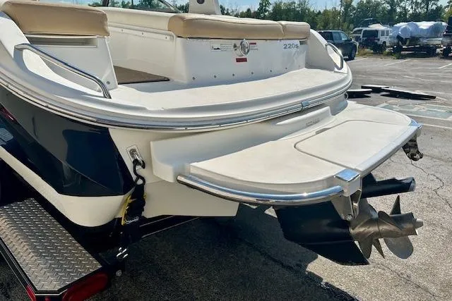 Slide: The Image of Rear view of 2015 Cobalt 220S boat with swim platform and propeller. - 4
