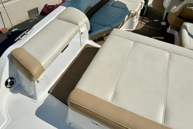 Slide: The Image of 2015 Cobalt 220S boat interior with beige and white seating. - 9