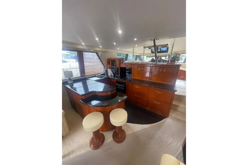 Slide: The Image of Yamaha audio system in 2004 Carver 570 Voyager Pilothouse wooden cabinet. - 11